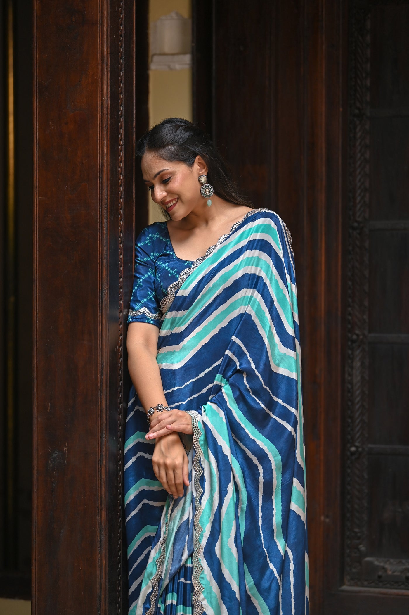 Blue and Sea Green Lehriya Crepe Saree with Scallop Mirror Work